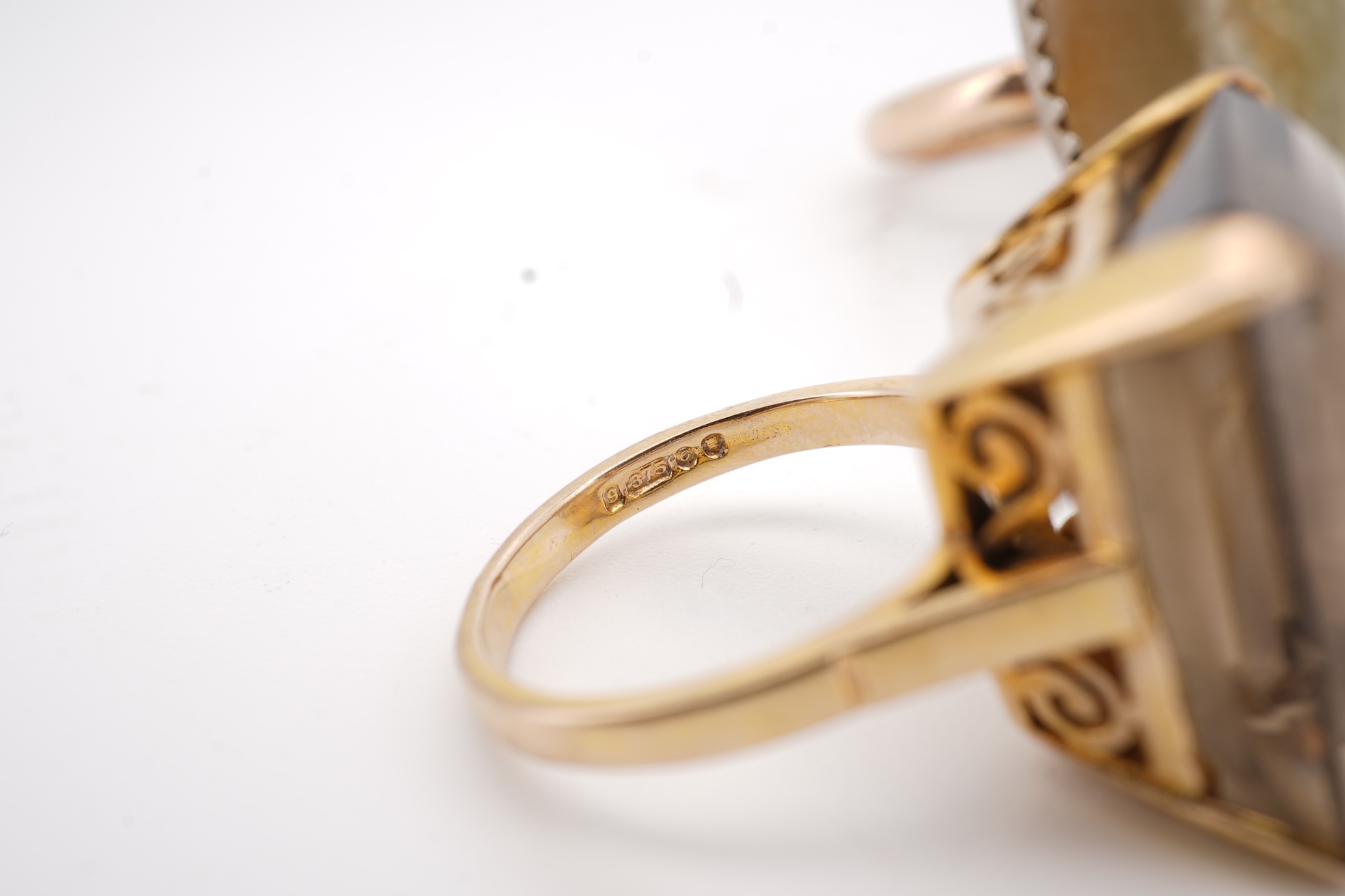 A modern 9ct gold and single stone emerald cut smoky quartz set ring, size N and one other 1960's 9ct gold shank, with a later added agate set white metal mount.